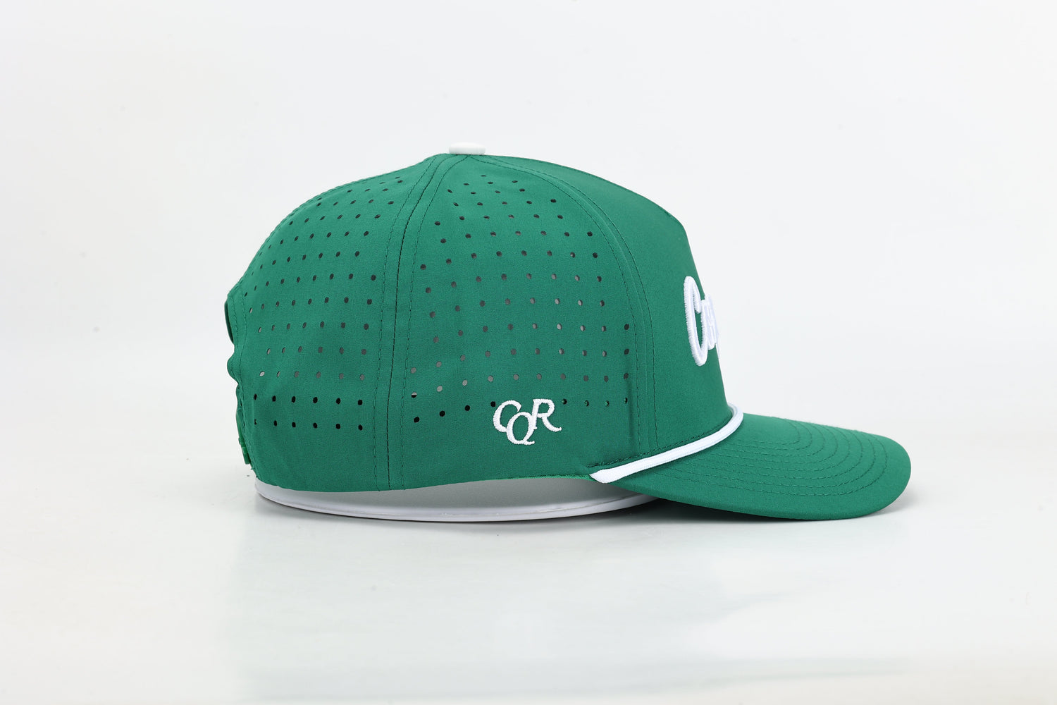 Model wearing Conquer Performance Golf Hat outdoors